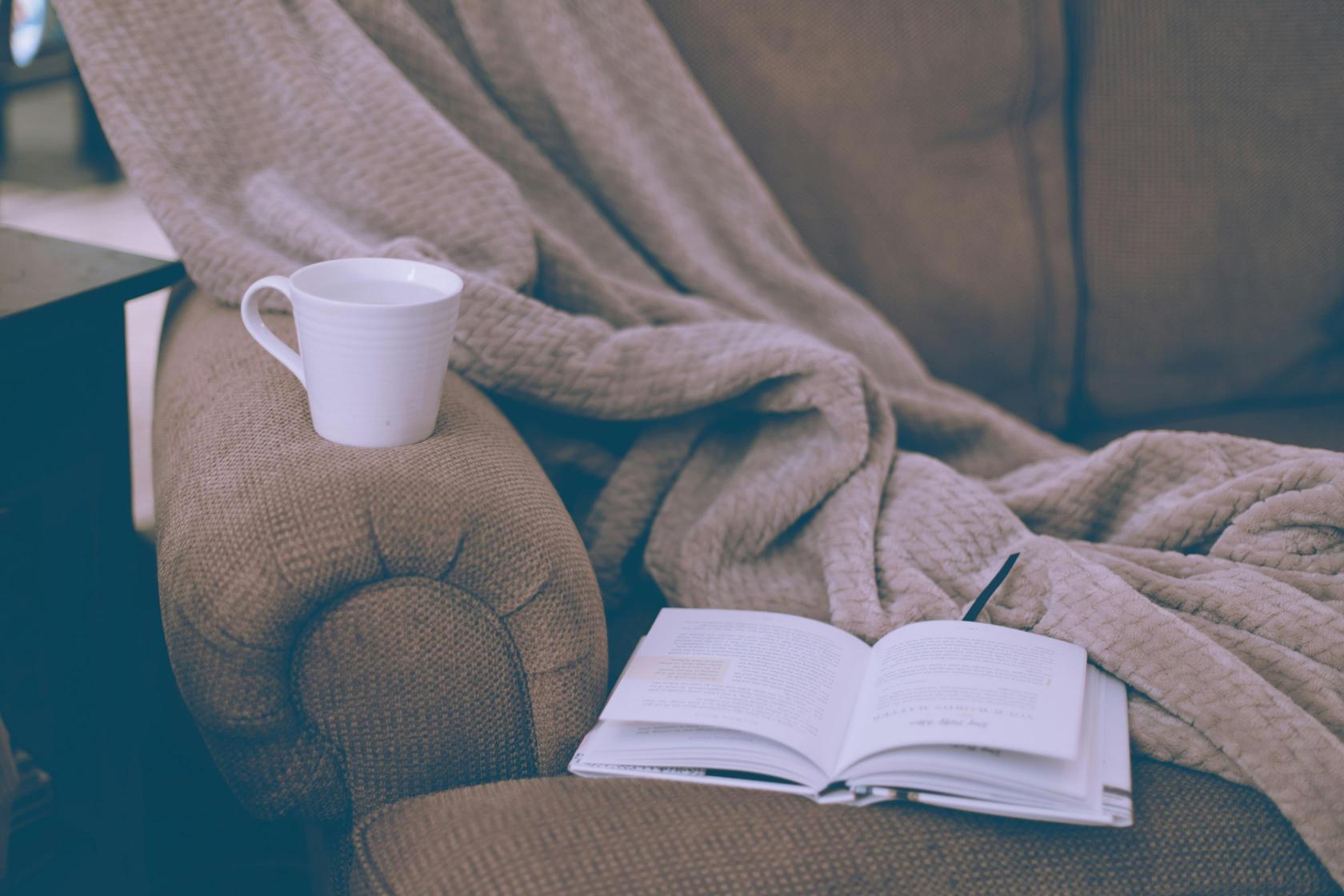 cosy-seating-area-with-a-book-and-a-cup-of-tea