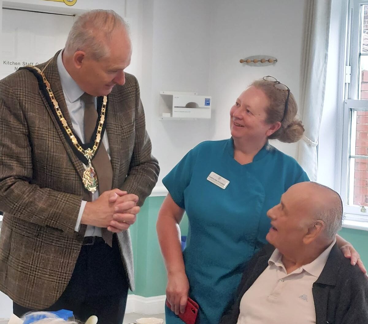 resident with staff and mayor